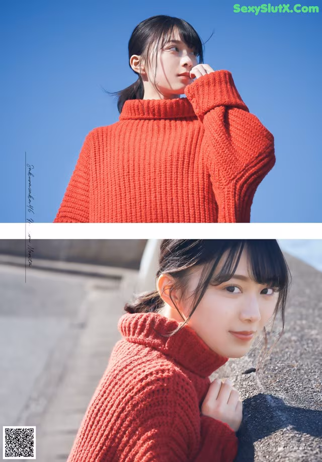 A woman wearing a red turtleneck sweater leaning against a wall.